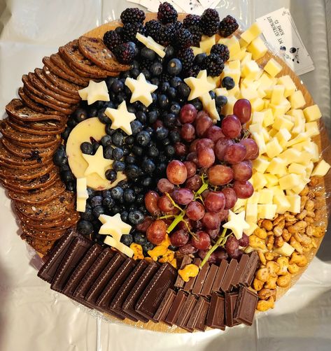 Eclipse Themed Charcuterie, Star Themed Dinner Party, Nye Party Themes Ideas, Star Themed Party Food, Space Themed Party Foods, Blue Moon Party Ideas, Moon And Star Charcuterie Board, Nye Theme Ideas, Celestial Charcuterie Board