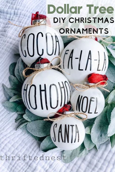 Rae Dunn inspired DIY Christmas ornaments - NO cricut required! These DIY farmhouse ornaments are made with supplies from the Dollar Tree. This Easy Christmas DIY project will show you how to make homemade Christmas ornaments. Looking for Dollar Tree Christmas decor? Here's these DIY Dollar tree ornaments!  #DIY #DollarTree #Christmas Dollar Tree Ornaments Diy, Diy Farmhouse Ornaments, Christmas Table Decorations Diy, Dollar Tree Christmas Decor, Farmhouse Christmas Ornaments, Farmhouse Ornaments, Diy Dollar Tree Decor, Dollar Tree Christmas, Dollar Tree Decor