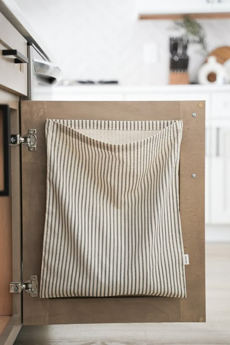 Discover the perfect blend of simplicity and functionality with our natural cotton woven RagBags. Perfect for storing used rags, cloths and dishtowels -   beautifully designed and made to last.  Save the extra trip from room to room and keep this soft, strong and sturdy bag hanging inside your cabinet door for easy access and a clutter-free space at a pleasantly affordable price.  Perfect for storing behind your kitchen sink cabinet for a hassle free experience when it's time to wash your cloths Dish Towel Basket Storage, Vintage Towel Storage Ideas, Dirty Kitchen Towel Storage, Kitchen Cloth Holder, Dish Towel Storage Ideas, Storing Reusable Bags, Thrifty Home Decor, Reusable Bag Storage Ideas, Small Room Storage Ideas