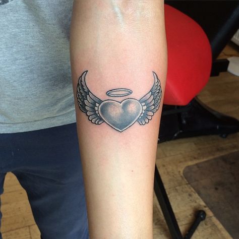 #angel #wing #tattoo #tattoos #ideas #designs #men #formen #menstattooideas Heart Angel Wings Tattoo, Wing Tattoos On Wrist, Wings Tattoo Meaning, Small Angel Wing Tattoo, Tattoo Bras Homme, Halo Tattoo, Heart With Wings Tattoo, Tattoos For Dad Memorial, Wing Tattoo Men