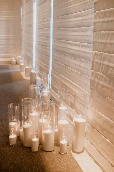 White Pillar Candles Wedding, Floor Candles Living Room, Candles On The Floor Wedding, Wedding Florals And Candles, Floor Candles Wedding, Enclosed Candles Wedding, Candlelit Sweetheart Table, Candle Decor Wedding Reception Ideas, Candles On Wedding Tables