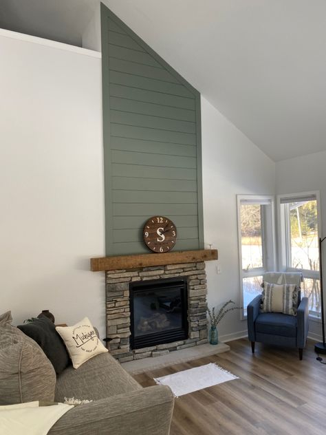 Painted Shiplap. Paint color: Behr Village Green, lightened by 20% #shiplap #fireplace #greenshiplap #homeupdates Accent Color On Fireplace Wall, Behr Gazebo Green Paint, Painted Shiplap Living Room, Sage Green Brick Fireplace, Dark Green Shiplap Fireplace, Evergreen Fog Fireplace Wall, Green Shiplap Fireplace Wall, Sage Fireplace Wall, Colored Shiplap Fireplace