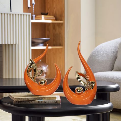 PRICES MAY VARY. Orange decor size 9.8"H x 5"L x 2.5"W. Small Ceramic Statue 8" high x 6" long x 2.5" wide.Can blend perfectly with most living room decor.Ceramic sculpture can be a perfect art piece for dining room or living room or office decor, coffee table decor [HOME DECOR AESTHETIC]Orange Modern Decor made of ceramic material, is an eye-catching piece. After being electroplated and polished, it shows off a mirror-like effect that will never fade [A GIFT EVERYONE LOVES] adornos para sala mo End Table Decor Living Room, Shelf Dining Room, Orange Dining Room, Table Top Decorations, Gold Room Decor, Gold Living Room Decor, Dining Room Shelves, Christmas Orange, Gold Room