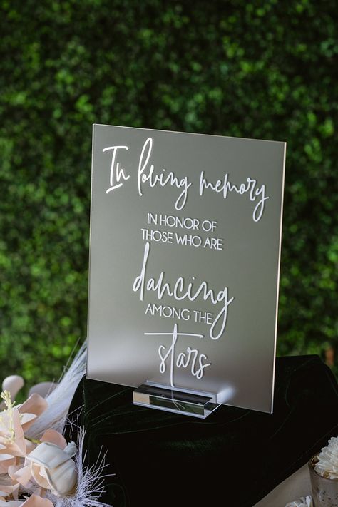 Click on the following link to browse HUNDREDS more designs in our shop!! https://pinkposiesandpearls.etsy.com/  In Loving Memory In Honor Of Those Who Are Dancing In Heaven Modern Clear Glass Look Acrylic Wedding Memorial Sign, SIG-DH5                                          | Welcome to Pink Posies and Pearls Wedding and Gift Boutique | | THE PRODUCT | *We love the clean lines of this clear acrylic In Loving Memory sign. We can print these signs in ANY color! Choose a color from the swatches image or let us know your custom color you would like printed (all but metallics). We offer clear stands. *.    This acrylic is a display material that is strong, moisture resistant & visually clearer than glass, not to mention shatterproof! *.    Need this in different wording? No problem! Put your Take A Glass Wedding Sign, Diy In Loving Memory Ideas, In Loving Memory Cricut Ideas, Glasses For Wedding Reception, Dancing In Heaven Wedding Sign, Under The Stars Wedding Decorations, In Memory Wedding Sign, Wedding In Memory Sign, In Honor Of Those In Heaven Wedding