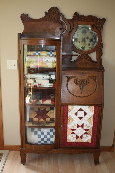 Storing small quilts in the antique secretary my mom just gave me.  Still need to add some decorative items to the top shelf. Antique Secretary Desks, Antique Secretary, Quilt Display, Quilt Rack, Quilt Shops, Quilts Decor, Quilt Storage, Products Ideas, Old Quilts