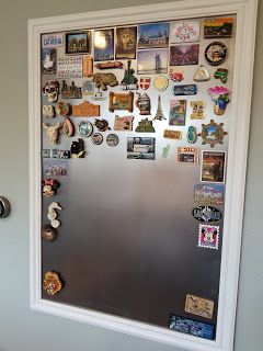 See how we DIY'd our own board to organize our travel magnet collection. It's pretty easy, you can make your own. Crafts and Projects Travel Room Decor, Souvenir Display, Travel Themed Room, Travel Gallery Wall, Travel Room, Travel Wall Decor, Magnet Collection, Travel Keepsakes, Magnetic Wall