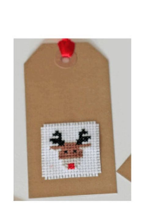 Fantastic simple cross stitch project - great for children and beginners, and a fun quick project for more experienced cross stitchers in the run up to Christmas! Would also make an excellent stocking filler. Kit includes materials and patterns for four children's themed Christmas gift tags. The kit contains everything you need to complete: - Pre cut and sorted DMC floss - 14 count white AIDA - Cross stitch needle - Cross stitch chart and key - 4 blank craft tags - cord / twine - beginner's guid Simple Christmas Cross Stitch, Cross Stitch Christmas Gifts, Christmas Cross Stitch Patterns Free, Cross Stitch Christmas Cards, Christmas Gift Tags Diy, Cross Christmas Tree, Xmas Tags, Tiny Cross Stitch, Xmas Cross Stitch