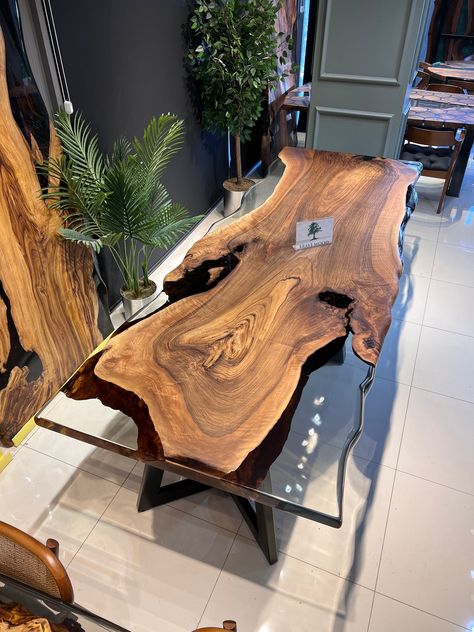 IN STOCK size 114" x width 43" Single body magnificent walnut ONE PİECE SPECİAL WALNUT TREE The visual of the color tones of the tree is fascinating. My design in the visual is ready and I can send it to you, my valued customers, immediately. It is a type of tree that is not always found I can customize the table for you. You have different colour options. After deciding we can make the table. Dining Table for your living room or kitchen. Custom made wood dining table with clear epoxy like river pattern. Unique, special design with soft edges and handmade production just for you, your home and your kitchen. Due to natural shape of wood there may be cracks on it. We try to protect the natural shape of the product as much as possible. And you have various colour options. Assembly is required Tree Trunk Dining Table, Epoxy Decor, Metal And Wood Bench, Luxurious Dining Room, Kitchen Custom, Luxury Dining Table, Table Epoxy, Beautiful Tablescapes, Walnut Tree