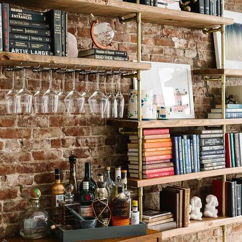 Beautiful moments from today's home tour with Alissa Lovens and Jonah in NYC. Their space was designed by @talirothdesigns with photos by @juliarobbs Check out the link above for the full tour! 👆🏽 #interiors #nyc Bookshelf Bar, Library Bar, Bookcase Bar, Bar Shelves, Home Bar Designs, Bedroom Bar, Home Bar Decor, Design Sponge, Wall Bar