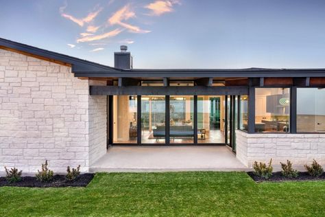 Transom windows beneath gabled roof lines create a light and airy interior in this Contemporary Hill Country home plan. Vaulted ceilings in the great room, study, and master suite enlarge the spaces, while 10 ft ceilings can be found everywhere else. An elongated island defines the open kitchen, simplifying the flow, and a butler's pantry nearby helps when entertaining with its prep sink, dishwasher, and additional cold storage. The master suite sits privately behind the double garage and featur Golf Cart Storage, Sink Dishwasher, Gabled Roof, Modern Ranch House, Mid Century Modern Exterior, Country Ranch, Hill Country Homes, Prep Sink, Modern Style House Plans