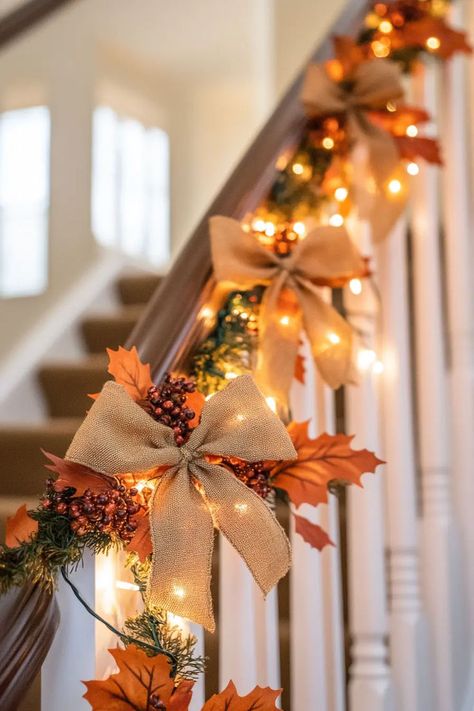 Fall staircase accented with lanterns filled with batteryoperated candles and pinecones Fall Decor Ideas For Staircase, Fall Garland For Staircase, Fall Decor Staircase, Fall Garland Staircase, Thanksgiving Staircase Decor, Fall Staircase Decor Railings, Fall Staircase Decor, Fall Staircase, Small Porch Fall Decorating Ideas