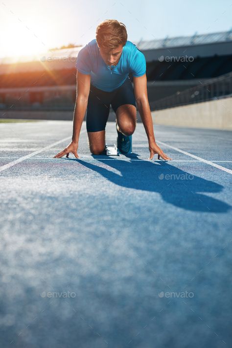 Professional male track athlete in starting blocks by jacoblund. Professional male track athlete in set position on sprinting blocks of an athletics running track in stadium.#athlete, #starting, #blocks, #Professional Track Senior Pictures, Running Pose, Confident Man, Track Runners, Field Athletes, Workout Pics, Running Photos, Portrait Photography Men, Running Track