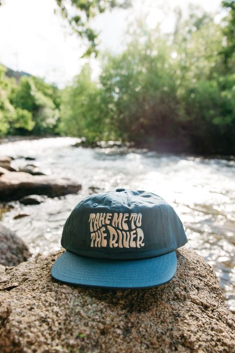 Calling all river lovers. Tag a friend that needs this hat! Creative Apparel Photography, Hat Product Photography Ideas, Outdoor Apparel Photography, Hat Product Photography, Hat Photoshoot Ideas, Outdoorsy Fashion, Hats Photography, Caps Ideas, Apparel Photography