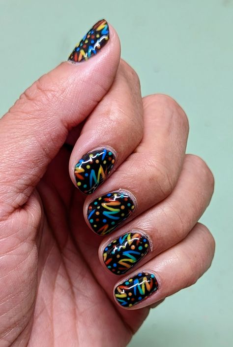 Short manicured nails with rainbow squiggles and dots on a black background reminiscent of the carpet found in roller rinks in the nineties Arcade Carpet Nails, Bowling Nails, Roulette Nails, Bowling Nail Art, Rolling Stones Nail Art, Weird Nail Art, Junkyard Nails, Roller Rink, Crazy Nails