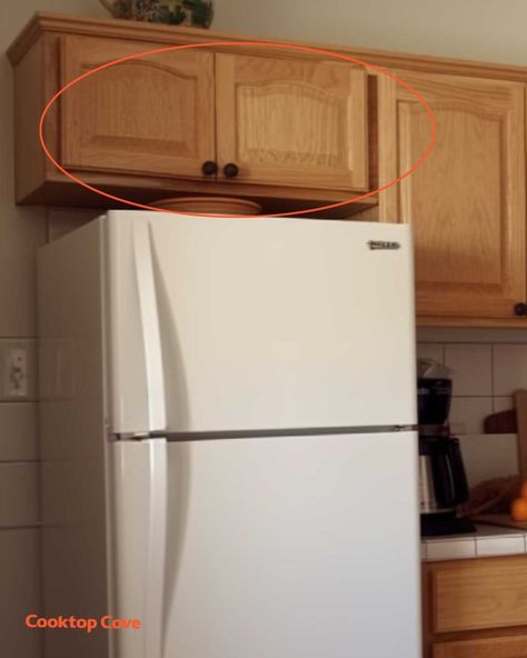 Most people think these cupboards are pointless. Here's how to properly use them Cupboard Over Fridge, Over Fridge Cabinet Organization, How To Arrange Kitchen Cupboards, Above Fridge Cabinet Organization, Cabinets Above Refrigerator Ideas, Open Cupboard Above Fridge, Top Of Cupboard Storage, What To Store In Cabinet Above Fridge, Beside The Fridge Storage