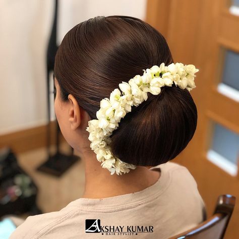 🎵ANOTHER ONE🎵 Sleek buns and fresh flowers will ALWAYS be a favourite  Hair by @akshaykumarhairstylist… Sleek Bun With Flowers, Bridal Buns Indian, Flower Gajra, Sleek Buns, Sleek Bun Hairstyles, Hairstyle Images, Hair Style On Saree, Bridal Bun, Low Bun Hairstyles