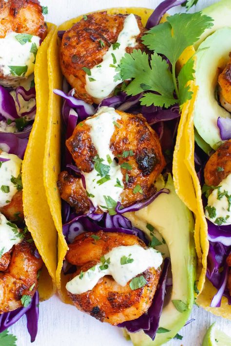 In under 30 minutes you can make up this easy Blackened Shrimp Tacos recipe! Spicy cajun seasoned shrimp are folded in toasted corn tortillas and topped with the best cilantro lime cream sauce. Make up these healthy and gluten-free tacos for a quick dinner on a busy weeknight. Quick Taco Recipes, Blackened Shrimp Tacos, Easy Taco Recipe, Shrimp Taco Sauce, Easy Grilled Shrimp Recipes, Cilantro Lime Shrimp Tacos, Sweet And Spicy Shrimp, Shrimp Taco, Spicy Shrimp Tacos