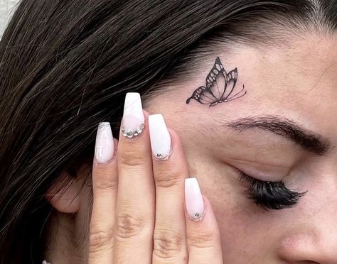 Cool Face Tattoos For Women, Tattoos On Face For Women, Butterfly Face Tattoos For Women, Face Tats Women, Small Face Tattoos For Women Under Eye, Tattoo Over Eyebrow, Baddie Face Tattoos, Sparkle Face Tattoo, Face Tats For Women Small