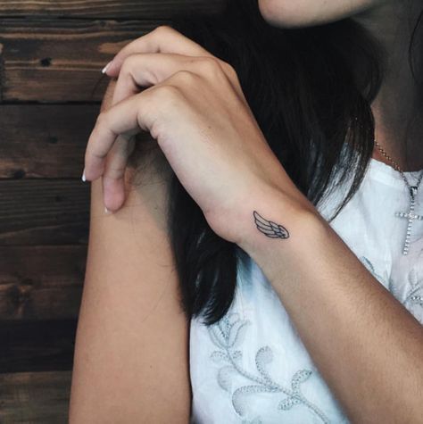 Tiny Wing Tattoo on Wrist by Sasha Masiuk Wing Tattoos On Wrist, Angel Wing Tattoo, A Small Tattoo, Tattoo Quotes For Men, Petit Tattoo, Retro Tattoos, Wrist Tattoos For Guys, Wing Tattoo, Small Wrist Tattoos