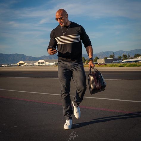 Dwayne 'The Rock' Johnson's Instagram is full of photos of his style, from the airport to the gym. Check out the best photos of The Rock's go-to airport style and travel fashion with products, shopping tips, and style advice here. Dwane Johnson, Dwyane Johnson, Dwayne Johnson Quotes, Wwe The Rock, Bald Men Style, Rock Johnson, The Rock Dwayne Johnson, Bald Men, Dwayne The Rock