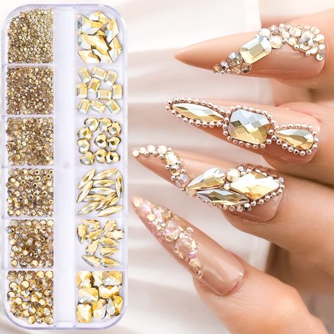 PRICES MAY VARY. Nail Rhinestones: Multi-sized gold nail rhinestones and gems set has about 1130 pieces rhinestones in different sizes. Round and special-shaped. High Quality: Made of pure high quality crystal glass, the coating is firmly bonded to the outer surface of each crystal bead for long lasting sparkle and brightness. Exquisite Design: With good hardness and transparency, our crystal diamonds look shiny and provide you with a professional manicure kit to make your nails more dazzling an Champagne Nails, Bling Nail Art, Crystal Decorations, Diamond Nail Art, Nail Rhinestones, Heart Square, Nail Art Jewelry, Manicure Diy, Gold Nail