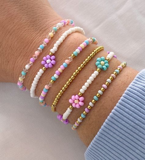 Pastel Summer Bracelet Stack ☀️ Made with frosty colored 3mm seed beads, 3mm bicone beads and 3mm gold filled beads The perfect dainty bracelet set, beautiful set to mix and match ✨🌸 CARING TIPS FOR YOUR JEWELRY ⭐️Treat and store with care. ⭐️ For longevity, avoid exposing your jewelry to water. ⭐️ Avoid having direct contact with lotions, perfumes, sanitizers as these chemicals may cause discoloration of your jewelry. Bead Designs Bracelet, Trendy Colorful Cheap Beads, Things Made With Beads, Good Bracelet Color Combinations, Where To Buy Seed Beads, Cheap Rainbow Beaded Bracelets For Everyday, See Bead Bracelets, Pink Beaded Bracelets For Spring, Friendship Bracelets With Letter Beads