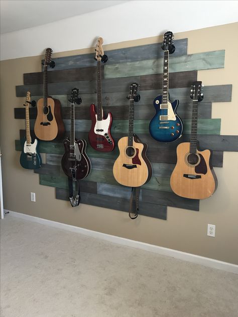 Decorate With Guitars, How To Display Guitars, Decorating With Guitars, Bedroom Ideas Guitar, Guitars Hanging On Wall, Display Guitars On Wall, Guitar Home Decor, Guitar Bedroom Ideas, Guitar Display Ideas