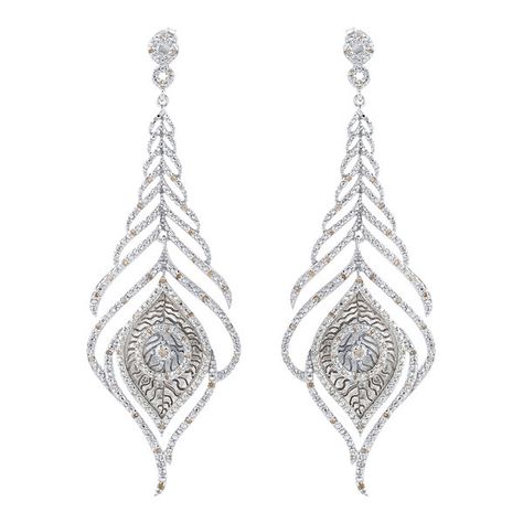 Victoria Kay Sterling Silver 1/2ct TDW Diamond Feather Earrings ($435) ❤ liked on Polyvore featuring jewelry, earrings, sterling silver butterfly earrings, long diamond earrings, pave earrings, feather earrings and long earrings Long Diamond Earrings, Sterling Silver Diamond Earrings, Victoria Kay, Feather Earrings Silver, Pave Earrings, Silver Butterfly Earrings, Round Diamond Earrings, Earrings Feather, White Diamond Earrings