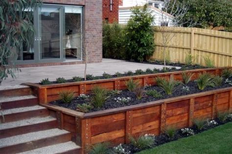 If your favorite outdoor space is your deck, we give you over 30 inspiring Deck Railing Ideas to show how you can spruce it up, from DIY to store bought. Wooden Retaining Wall, Wood Retaining Wall, Spa Landscaping, Sloped Yard, Raised Flower Beds, Sloped Backyard, Outdoor Stuff, Swim Spa, Diy Deck