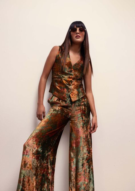 Introducing a sophisticated waistcoat & pants co-ord set, featuring an abstract floral print meticulously crafted in soft velvet. This ensemble exudes elegance and style, perfect for making a statement at any event. Elevate your wardrobe with this luxurious combination that effortlessly blends comfort and fashion.