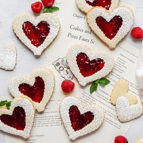 Raspberry Linzer Cookies Heart Shaped Desserts, Raspberry Linzer Cookies Recipe, Raspberry Linzer Cookies, Valentines Day Cookie Recipe, Linzer Cookies Recipe, Homemade Raspberry Jam, Red Desserts, Almond Cookie, Valentine's Day Celebration