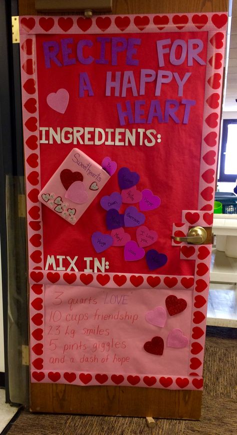 "Recipe For A Happy Heart" Valentine's Day classroom door idea. Valentines Cafeteria Bulletin Board, Classroom Decorations For Valentines Day, Door Ideas For Valentines Day, Valentine Bulletin Board Ideas Toddlers, Heart Door Decorations Classroom, Valentines Day Window Display Preschool, Valentines Day Door Decorations For Classroom February Bulletin Boards, Classroom Valentine Ideas Decor, Friendship Day Decoration Ideas For School