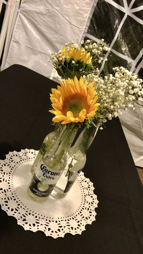 Unique Birthday Centerpieces, Beer Bottle Centerpieces For Birthday, 21st Birthday Table Centerpieces For Guys, Modelo Beer Centerpieces, Beer Mug Centerpiece Table Decorations, Beer Bottle Flower Arrangements, Beer Themed Centerpieces, 21st Bday Centerpieces, Diy 60th Birthday Centerpieces