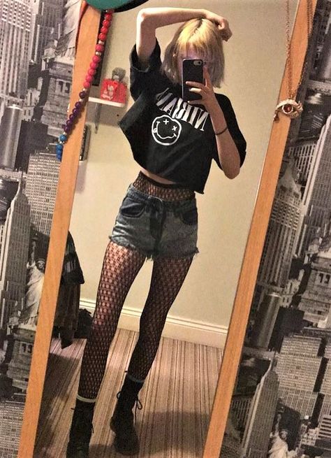 Oversized "Nirvana" band crop top, denim shorts, fishnet stockings & combat boots by celestialsmoke Shorts And Fishnets, Punk Pastel, Oversized Shorts, Nirvana Band, Fashion Alternative, Fashion Goth, Stockings Outfit, Grunge Outfit, Pastel Grunge