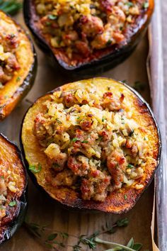 This savory stuffed acorn squash is so delicious it’s addicting! A sausage and cauliflower rice stuffing is seasoned with lots of fresh herbs and served toasty in roasted acorn squash bowls. Perfect as a holiday side dish or an anytime meal. Paleo, Whole30, and low in carbs. Acorn Sausage Squash, Savory Stuffed Acorn Squash, Acorn Squash Bowl Recipes, Acorn Squash With Stuffing, Sausage Acorn Squash Recipes, Sausage Stuffed Acorn Squash Recipes, Stuffed Acorn Squash Recipes, Cauliflower Stuffing, Acorn Squash Stuffed