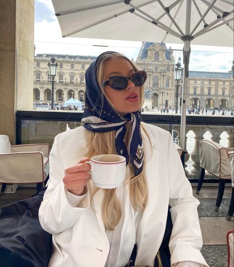 Coffee, girl in Paris, hot chocolate, silk scarf, sunglasses, Parisian style, blonde hair, blonde girl Coffee In Paris, Paris Louvre, France Outfits, Morning Aesthetic, Louvre Paris, Square Scarf, Croissant, Parisian Style, Old Money