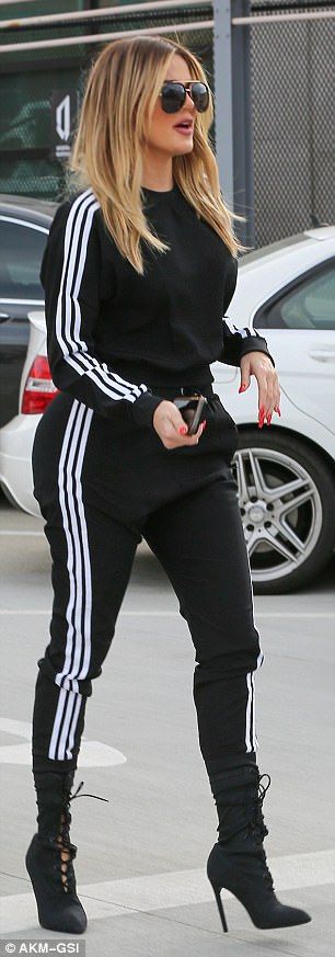 Monochrome: The 32-year-old reality star wasn't in fact wearing her own brand for the outi... Sweat Suit With Heels, Track Suit Outfits Women, Tracksuit With Heels, Adidas Track Suit Outfit, Black Tracksuit Outfit, Estilo Khloe Kardashian, Black Striped Pants, Khloe Kardashian Style, Track Suits Women