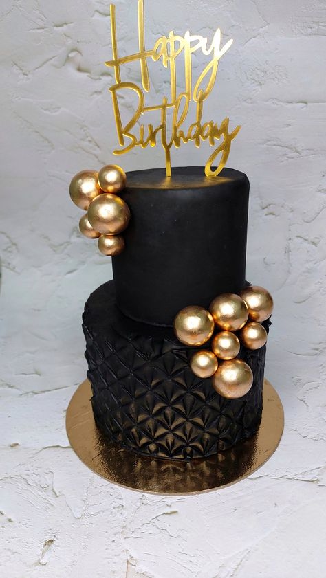 Black & Gold Fondant Cake- 2 tier To order- whatsapp on 999719709 #blackcake #cake #cakes #blacksndgoldcake #cakeideas #cakedesigns #fondantcake #divacake #birthdaycake #engagementcake #anniversarycake Black Two Tier Cake, Black And Gold 2 Tier Cake, Black 2 Tier Cake, Black Fondant Cake, Cake Black And Gold, Diva Birthday Cakes, Dark Cakes, Black And Gold Birthday Cake, Gold Fondant