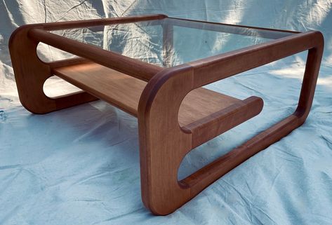 "Made out of locally sourced solid wood, this mid century inspired coffee table will bring a touch of elegance to any room. Constructed with longevity in mind this table will last generations.  Comes in solid Cherry, Maple or Walnut. Walnut is protected with a natural stain to show off the natural beauty of walnut and the cherry/maple can be stained to many options. Example shown is solid maple with a mahogany finish. Measures 36\"x36\"x16\". This item ships via courier and shipping quotes will be available upon request due to the size and shape, prices range from $50 - $200 for domestic shipping and $100 - $350 for international.  Unit comes flat packed and requires assembly." Mid Century Coffee Table Decor, Plant Coffee Table, Mcm Coffee Table, Retro Coffee Table, Coffee Table Mid Century, Mid Century Interior Design, 60s Furniture, Coffee Table Ideas, Vintage Tables