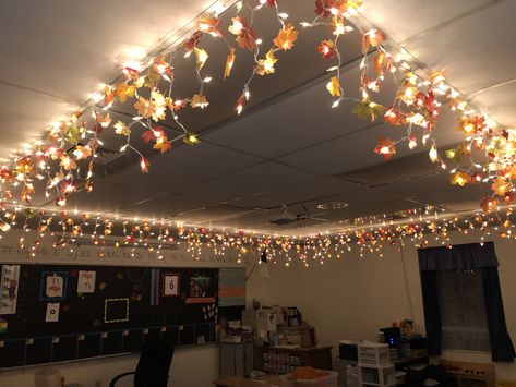 Fall lights for my classroom. Icicle lights+dismembered leaf garlands+hot glue gun Ceiling Crafts For Classroom, Halloween Theme Classroom Decorations, Classroom Ceiling Christmas Decor, School Ceiling Decorations, Lighting For Classroom, Classroom Ceiling Lights, Classroom Twinkle Lights, Classroom Christmas Decorations Ceiling, Christmas Ceiling Decorations Ideas Classroom