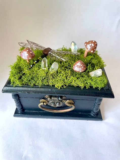 "Store jewelry or other small treasures inside. decorative wood access on the front. Moss, mushrooms, crystals and dragonfly on top of box.  painted natural wood box. inside has a shelf with magical miniature decorations. Size 5.25\" x 3.12\" x 2.5\"" Spell Box Diy, Wood Box Decoration Ideas, Decorating Wooden Boxes, Small Boxes Crafts, Crystal Box Ideas, Trinket Boxes Diy, Upcycled Jewelry Box Diy, Wood Box Painting Ideas, How To Make Miniature Things