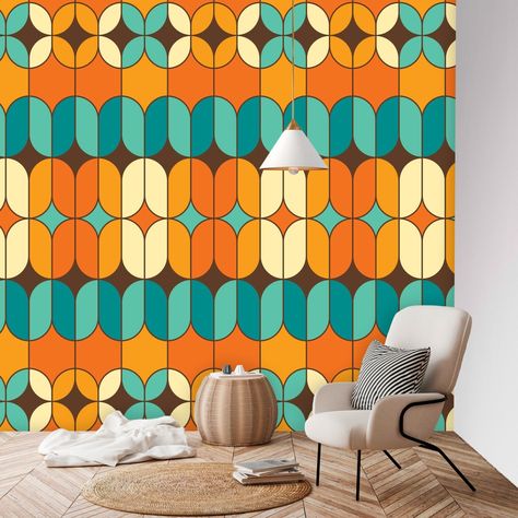 Imagine a wall mural that perfectly encapsulates the spirit of the 70s with a Mid-Century Modern twist. The wallpaper is designed with a vibrant color palette that primarily features shades of orange and teal blue. The pattern is geometric, with a mix of geometric and abstract shapes that interlock and overlap in a harmonious, yet dynamic arrangement. This design pays homage to the groovy aesthetics of the 70s, characterized by bold patterns and a sense of movement, while also embodying the slee Modern Peel And Stick Wallpaper, 70s Wall Mural, Mid Century Modern Christmas, Groovy 70s, 70s Decor, Mid Century Modern Walls, Retro Valentines, Bold Patterns, Perfect Pillow