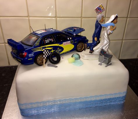 Subaru car enthusiast wedding cake with bride dragging groom chocolate fudge cake Car Guy Wedding Ideas, Car Wedding Cake, Racing Room, Car Themed Wedding, Unusual Wedding Cakes, Car Cake Toppers, Wedding Cake Images, Funny Wedding Cakes, Car Wedding