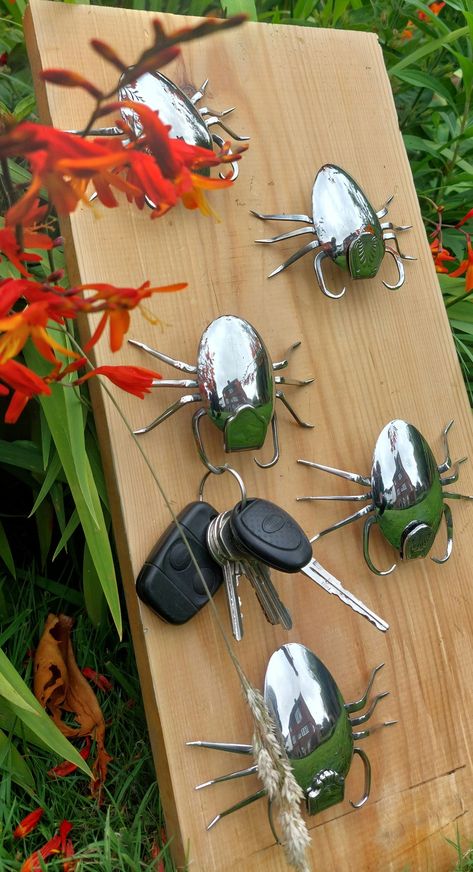 Cute Bug Key Hanger made from upcycled cutlery - Gift Ideas, Recycled Silverware, Hand made Item, Wall Art, Organizer. These Scorpion bugs can be mounted anywhere with a single nail or screw. Never lose your keys again with this unique, fun and functional stainless steel guardian watching over them! Made from reclaimed materials: Two dessert spoons Two forks 2 patterned handles Please note, all bugs are broadly similar but there may be some subtle variation in design / pattern. Contact me direct Bugs Made Out Of Recycled Materials, Old Key Crafts, Art Organizer, Bug Gifts, Recycled Silverware, Cutlery Art, Insect Crafts, Silverware Art, Aluminum Can Crafts