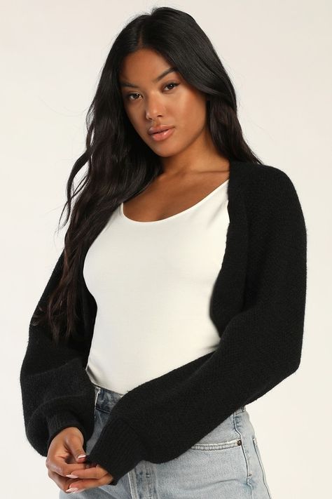 Sweater season just got better now that we've got the Lulus Warm Comfort Black Long Sleeve Open-Front Shrug Sweater! This open-front shrug-style cardigan sweater has long balloon sleeves (with fitted cuffs) and an ultra-cropped hem that layers well over casual tanks and tees or flirty night-out dresses to keep you cozy all season long! Black Shrug Outfit, Shrug Outfit, Shrug Style, Black Cropped Cardigan, Black Shrug, Knit Shrug, Sweater Season, Lulu Fashion, Casual Tanks