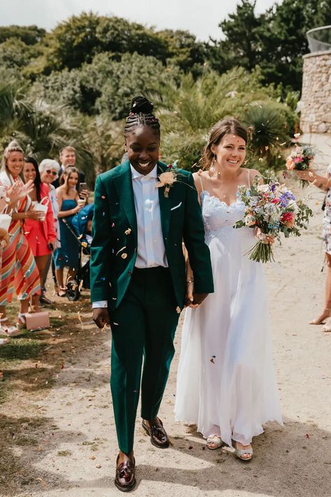 Lesbian multicultural wedding at Tremenheere Sculpture Gardens with local flowers and bridesmaids suits, shot by Jessica Hopwood Photograhy. Suits For Lesbian Wedding, Green Suit Women Wedding, Women In Wedding Suits, Womens Suit For Wedding, Woman In Suit Wedding, Green Suit Wedding Women, Lesbian Wedding Party Outfits, Masc Fem Wedding, Green Wedding Suit Women