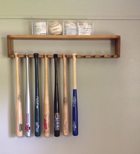 DIY mini bat rack Bat Holder For Room, Basement Mancave, Baseball Things, Baseball Project, Bat Display, Spiral Drawing, Baseball Ideas, Crochet Game, American Crochet