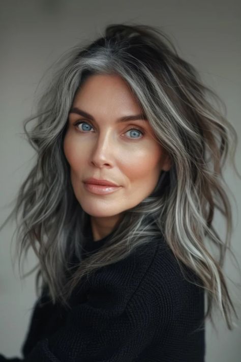 Woman with striking grey hair and blue eyes, gazing directly at the camera with a subtle smile, against a neutral background. Grey Brown Hair, Gray Balayage, Grey Hair Transformation, Black Cake, Grey Hair Inspiration, Beautiful Gray Hair, Gray Hair Growing Out, Natural Gray Hair, Silver Grey Hair