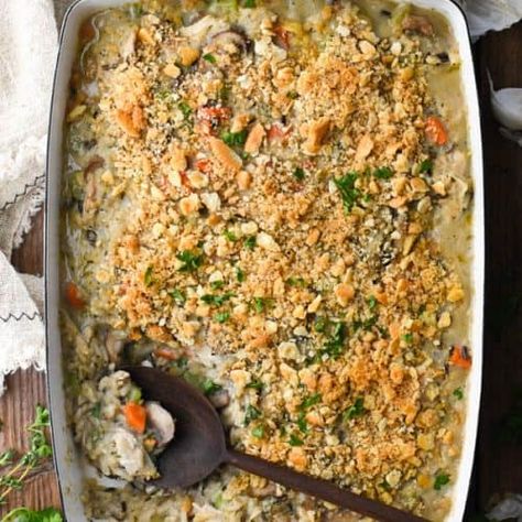 Make this easy Chicken and Wild Rice Casserole from scratch with simple, wholesome ingredients. The flavorful rice, vegetables and tender chicken come together in a creamy sauce with a buttery Ritz cracker topping. Celery Casserole, Chicken And Wild Rice Casserole, Ritz Cracker Topping, Green Bean Casserole Bacon, Easy Corn Casserole, Celery Recipes, Wild Rice Casserole, Cooking Wild Rice, The Seasoned Mom