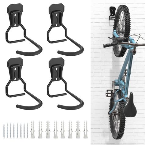 PRICES MAY VARY. 🛵 Heavy Duty Bike Rack: Made of strong iron material, provide a high load capacity, up to 77-99lbs/35-45kg. Strong enough to hold all kinds of bicycles, like mountain bike, road bike, cruiser bike, kids bike, etc. 🛵 Easy to Use: Hang and detach the bike in a second, easily store your bike inside your garage, carport, or apartment. 🛵 Horizontal Bike Storage: Foldable design that you can fold the bicycle holder upwards when not in use, save more space for storage. A must-have s Bicycle Hanger, Bike Hooks, Garage Hooks, Range Velo, Bike Hanger, Support Velo, Garage Bike, Bicycle Frames, Bicycle Storage